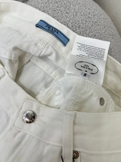 White jeans with classic triangle logo